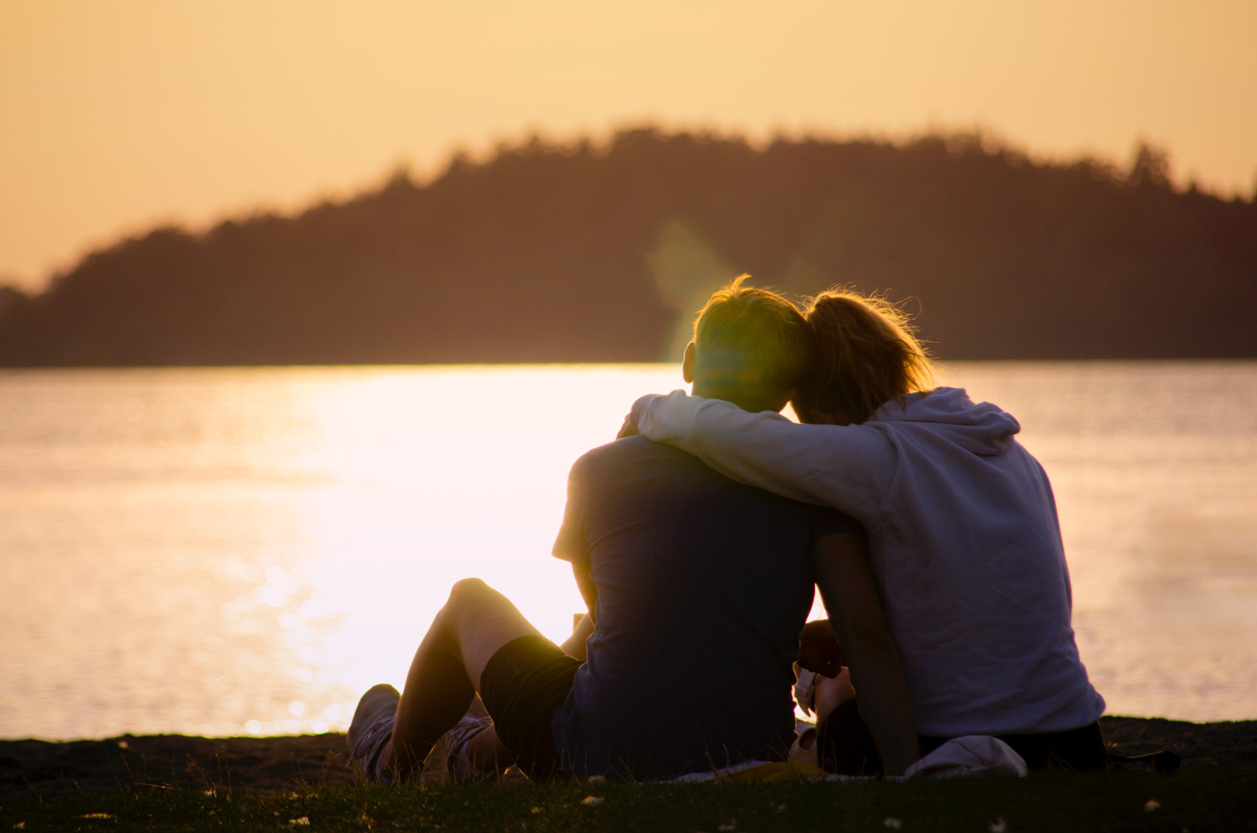 Couple discussing estate planning and watching a sunset